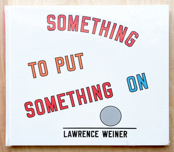 SOMETHING TO PUT SOMETHING ON by Lawrence Weiner